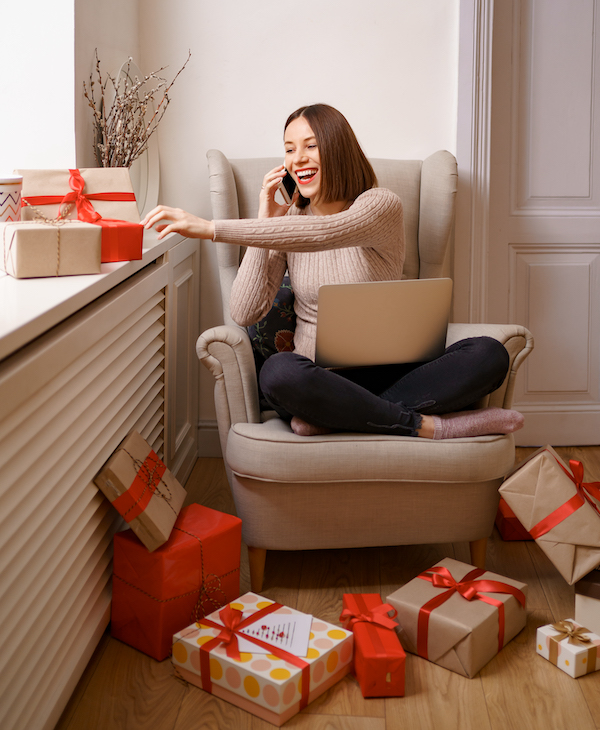 Woman sitting with presents | AVIXA Woman sitting with presents | AVIXA